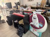 a white dog sitting on a chair in a room