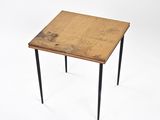 an image of a small table with a wooden top and black legs