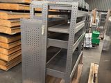 a large stack of shelves in a warehouse with pallets of wood