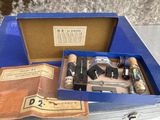 a blue box with various items in it on a table