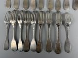 a lot of forks and spoons that are on the table