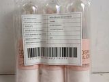 three bottles of lip bales in a plastic bag on a table