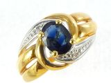 two tone gold and silver ring with a blue stone and diamonds