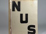 a book with the words nus on it sitting on a table