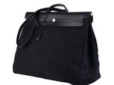 a black bag with a handle on a white background