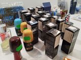 many different types of perfumes on the table