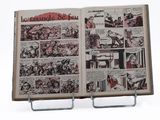 an open book with a picture of a comic strip