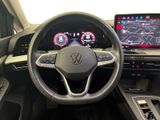 the interior of a car with a steering wheel, dashboard, and display screen