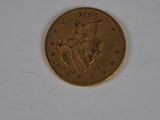 a gold coin with a picture of a man on it