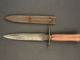 a knife and a knife holder on a table