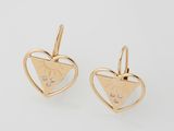 a pair of gold earrings with diamonds in the shape of a heart