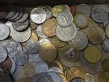 a lot of coins in a box on the table