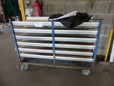 a cart that has a bag on top of it