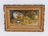 un tableau représentant des citrons et un bol de citrons posés sur une table