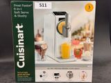 emballage d'une boîte sur laquelle figure l'image d'un extracteur de jus