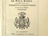 un vieux livre avec l'image d'un blason
