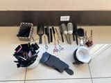many different types of hair brushes and combs on the floor