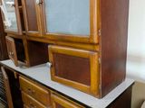 a wooden cabinet with a tv on top of it