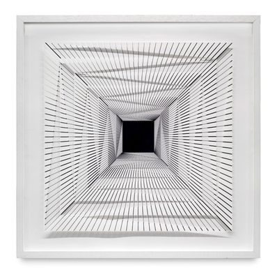 black and white photograph of an empty room with a square opening