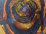 an abstract painting of a spiral design with yellow, red, and blue colors