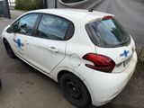 a small white car parked on the side of the road