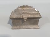 a small silver box sitting on top of a table
