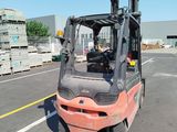 a forklift that is sitting in the middle of the road