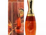 an image of a bottle of perfume sitting next to a box