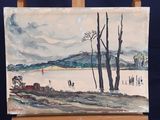 a painting on a easel with a picture of a lake