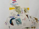 a pile of stamps on top of each other on a table