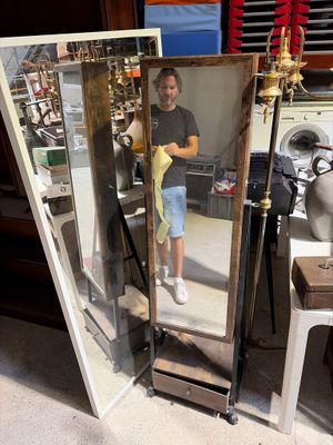 a mirror that has a picture of a woman in it