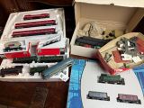 a lot of toy trains in a box on a table