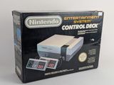 an old nintendo entertainment system with a controller in the box
