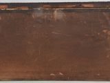 a picture of an old rusted metal box on a table