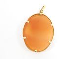 an orange agite pendant on a gold plated chain