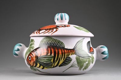 a white bowl with a fish design on it