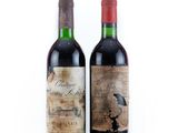 two bottles of wine sitting next to each other on a white surface
