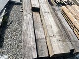 several pieces of wood are stacked on top of each other in a pile
