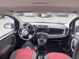 a small car with red seats and a steering wheel