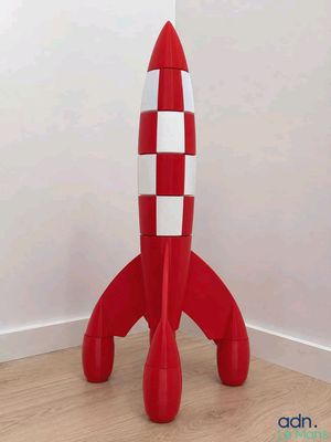 une image représentant une table en forme de fusée, rouge et blanche