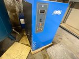an image of a blue machine sitting inside of a building