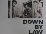 une vieille affiche de cinéma du film « Down by Law » représentant deux hommes