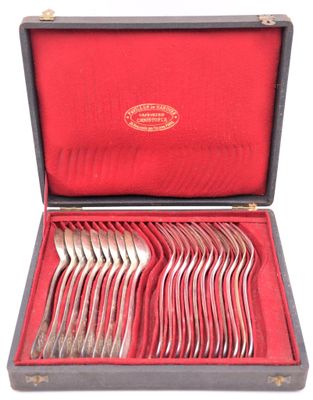 silverware in a case with red lining on a white background