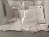 many pieces of paper that are sitting on a table