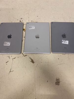 four ipads are lined up in a row on a table