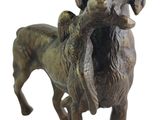 bronze statue of a dog holding a bird in its mouth