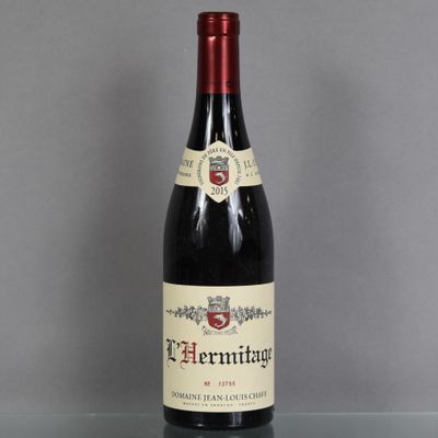 a bottle of wine that is sitting on a table