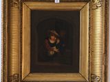 une peinture à l'huile représentant une femme tenant un enfant dans ses bras, dans un cadre doré