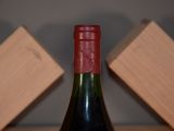 a bottle of wine that is sitting on a table