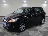 a black ford c - max parked on a checkered floor